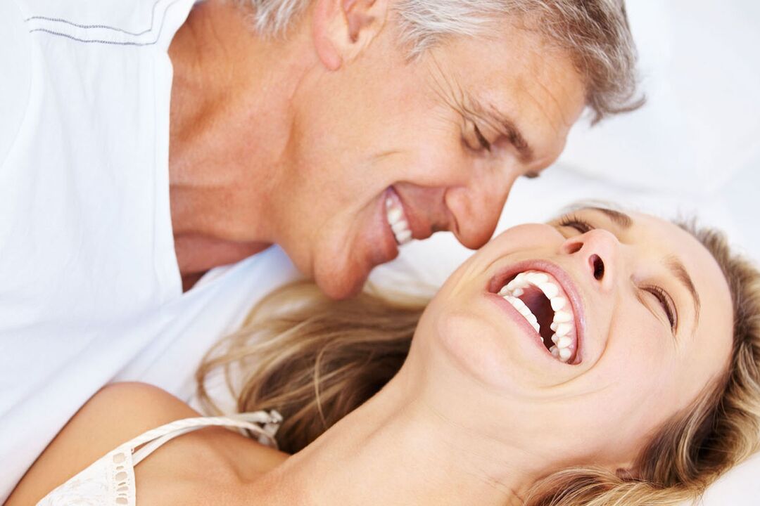 Happy woman with a middle-aged man with no problems with potency